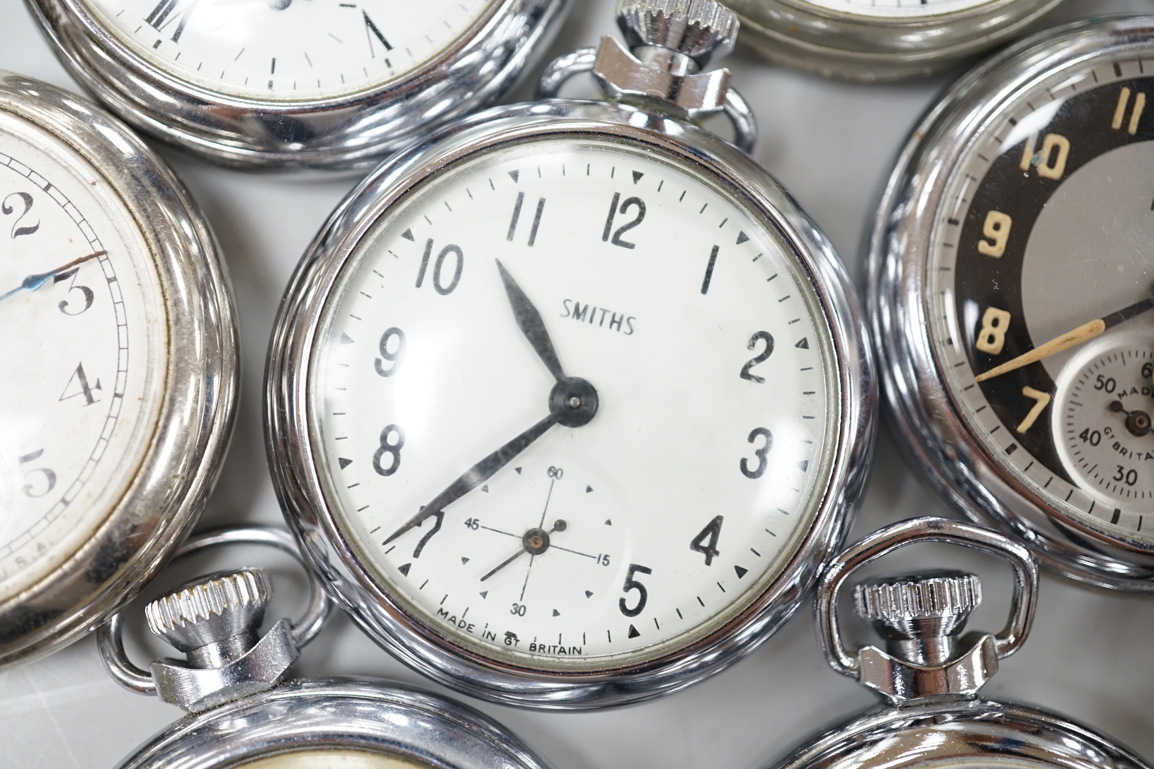 Ten assorted base metal pocket watches including Ingersoll and Smiths.